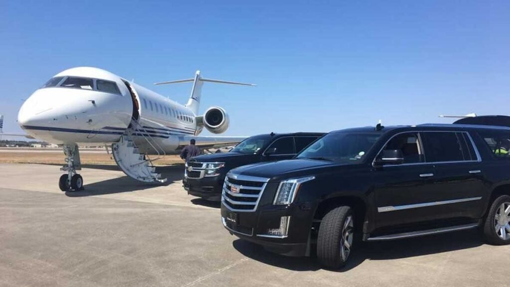 Private jet and luxury black SUVs parked at John F. Kennedy Airport (JFK), showcasing premium ground and air travel.